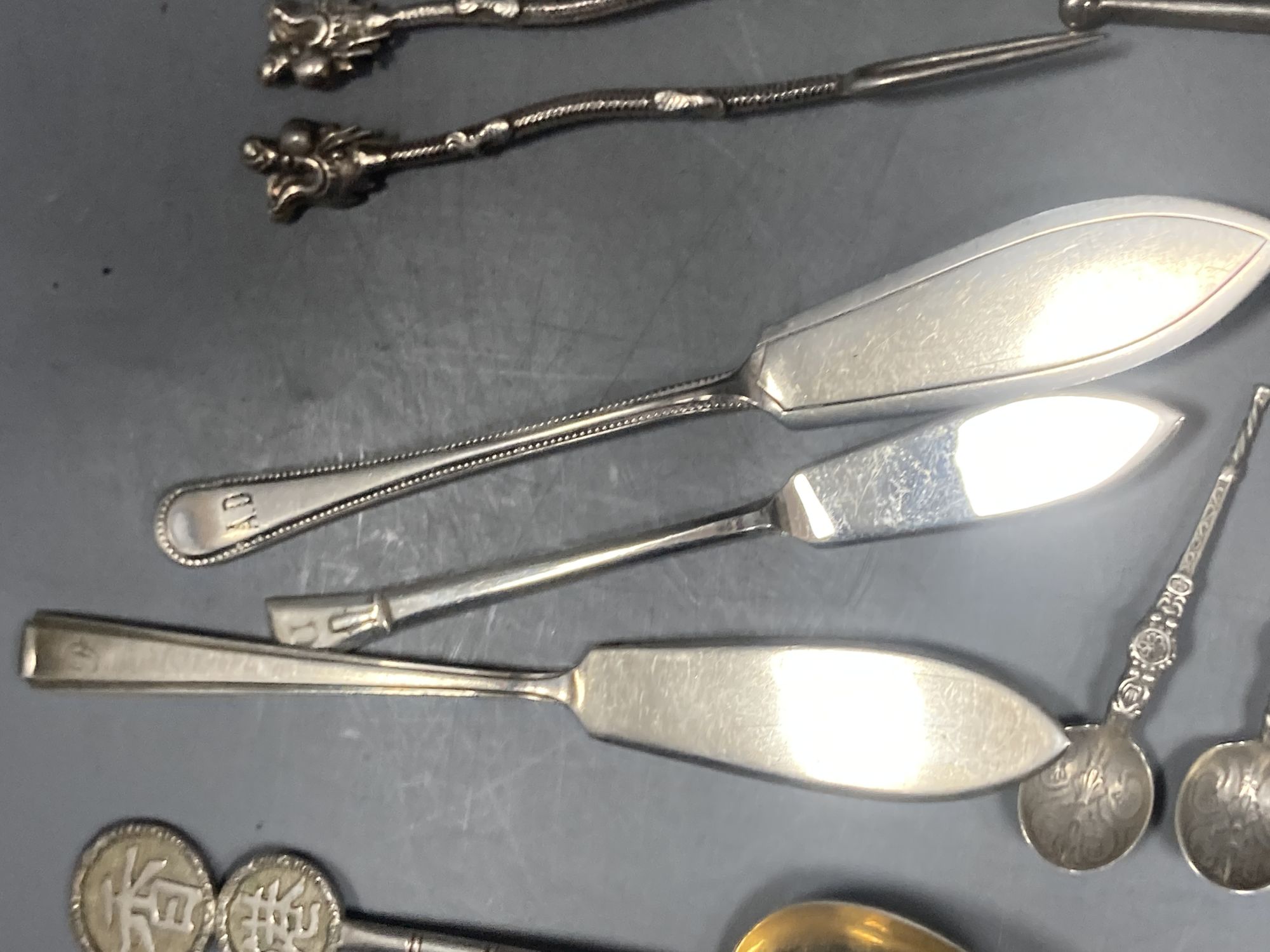 A group of assorted Chinese white metal spoons and forks, including set of six teaspoons and ten small items of English silver.